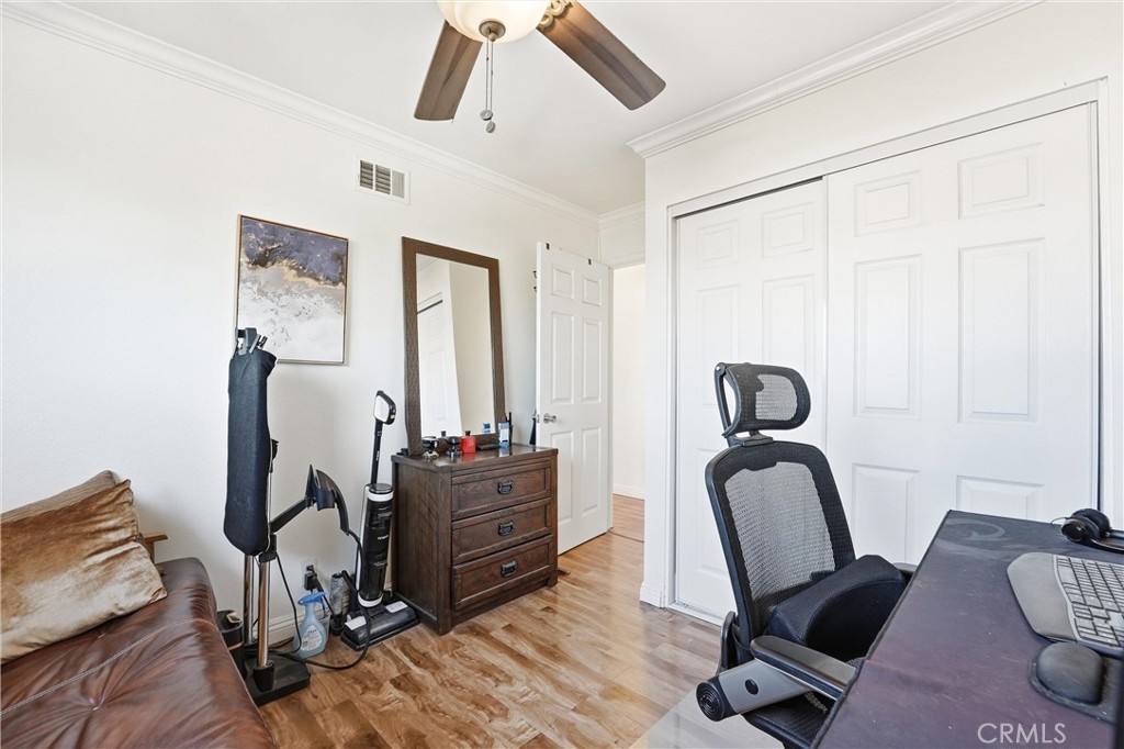 11908 Fallingleaf Circle Garden Grove, CA 92840 - Photo 16 of 30 a view of a workspace with furniture and gym equipment