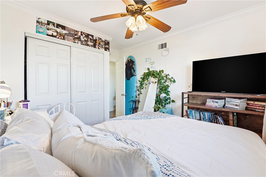 11908 Fallingleaf Circle Garden Grove, CA 92840 - Photo 18 of 30 a bedroom with a bed and a flat screen tv
