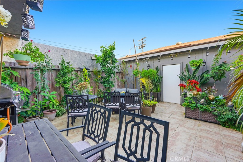 11908 Fallingleaf Circle Garden Grove, CA 92840 - Photo 21 of 30 a view of a chairs and table in the back yard of the house