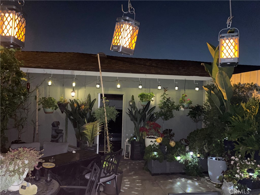 11908 Fallingleaf Circle Garden Grove, CA 92840 - Photo 23 of 30 a view of a entryway door with potted plants in front of house