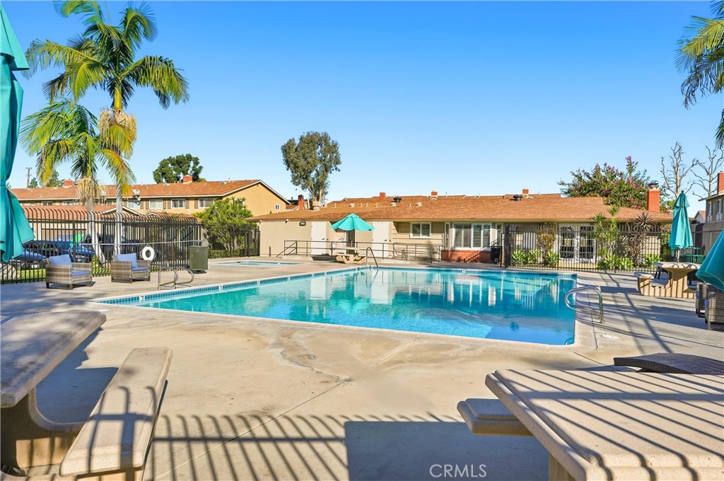 11908 Fallingleaf Circle Garden Grove, CA 92840 - Photo 30 of 30 a view of a swimming pool with a table and chairs