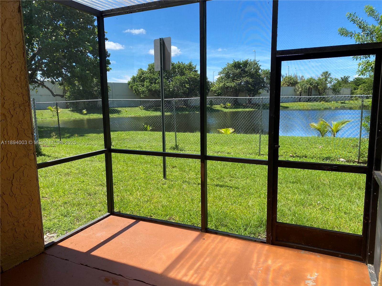 4453 Treehouse Lane, Unit C Tamarac, FL 33319 - Photo 18 of 21 a view of outdoor from window