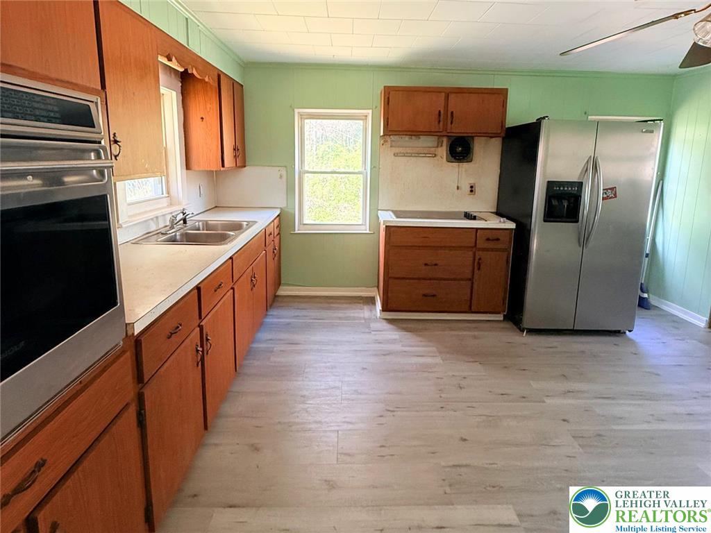 3420 Little Gap Road Palmerton, PA 18071 - Photo 11 of 26 a kitchen with stainless steel appliances granite countertop a refrigerator a stove and a sink