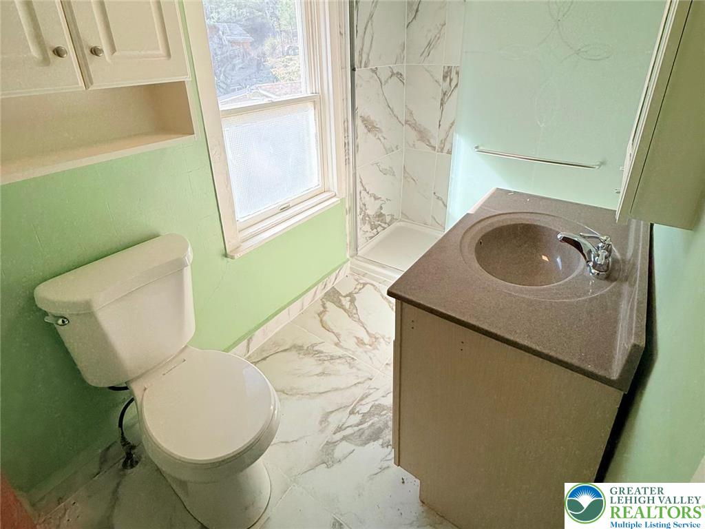 3420 Little Gap Road Palmerton, PA 18071 - Photo 18 of 26 a bathroom with a toilet sink and mirror