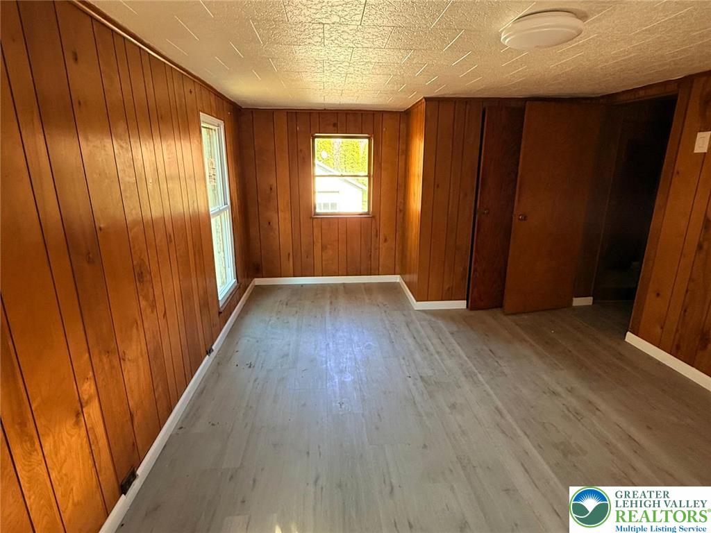 3420 Little Gap Road Palmerton, PA 18071 - Photo 21 of 26 an empty room with wooden floor and windows