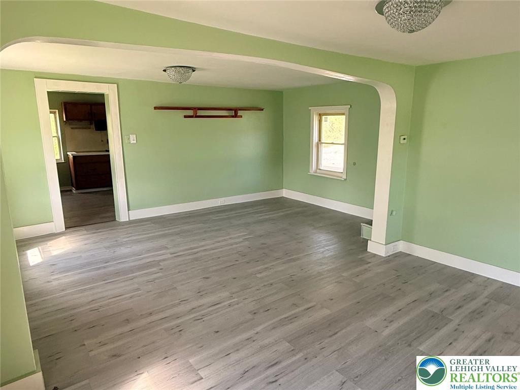 3420 Little Gap Road Palmerton, PA 18071 - Photo 7 of 26 an empty room with wooden floor and windows