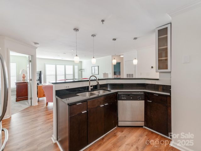 a kitchen with a sink and cabinets