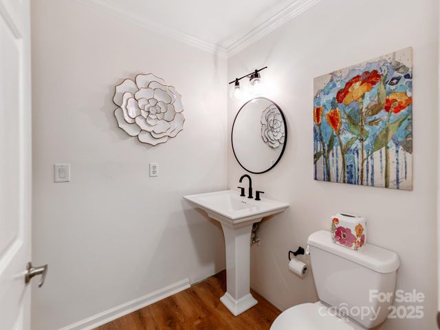 a bathroom with a toilet a sink and a mirror