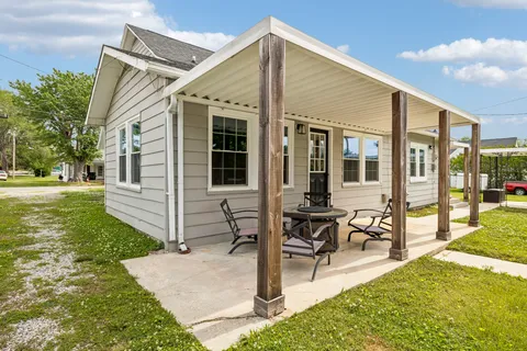 a front view of a house with a yard