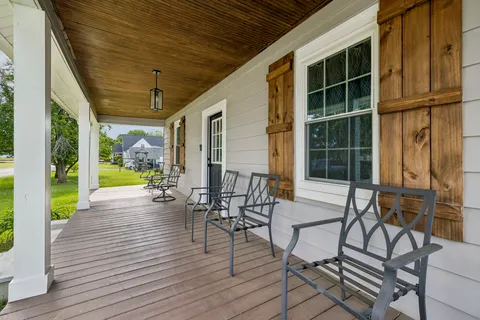 a view of porch with seating area
