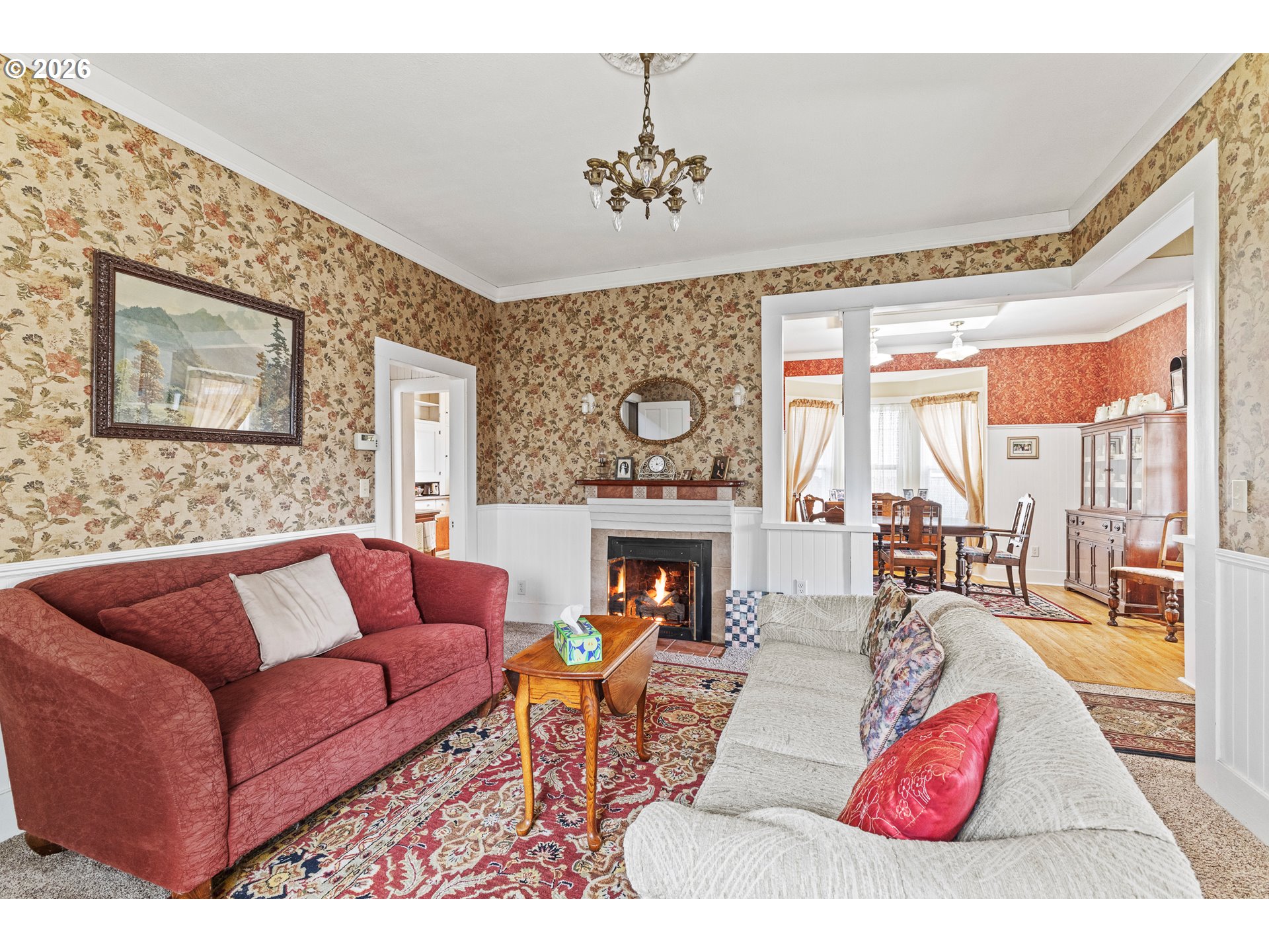 1150 West 8th Street Coquille, OR 97423 - Photo 25 of 42 a living room with furniture a fireplace and a large window