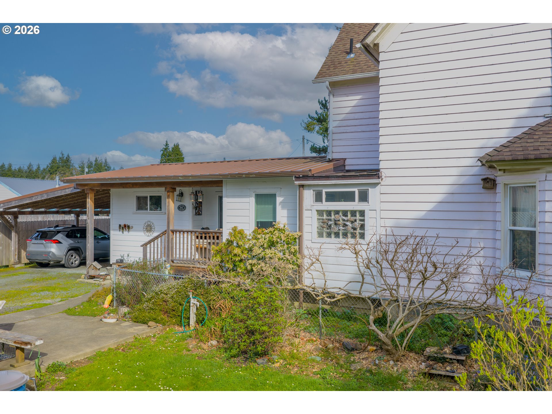 1150 West 8th Street Coquille, OR 97423 - Photo 3 of 42 a view of a house with a patio