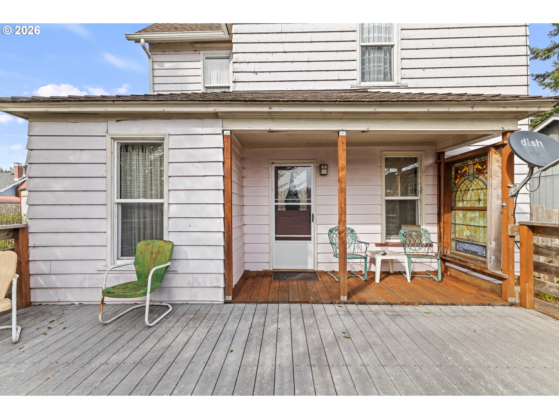 1150 West 8th Street Coquille, OR 97423 - Photo 4 of 42 a view of a house with wooden deck and furniture