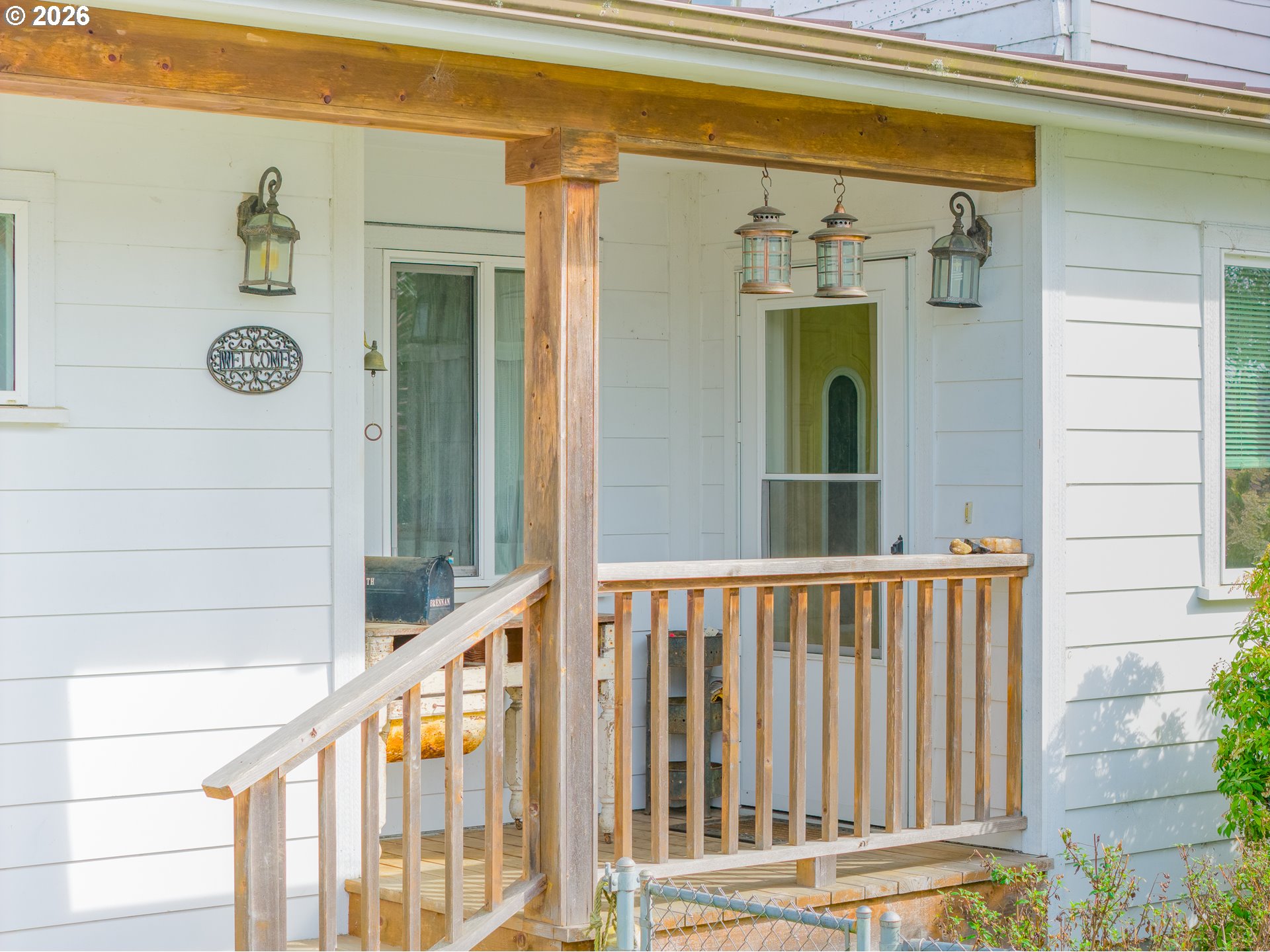 1150 West 8th Street Coquille, OR 97423 - Photo 5 of 42 a view of a porch with a table and chairs