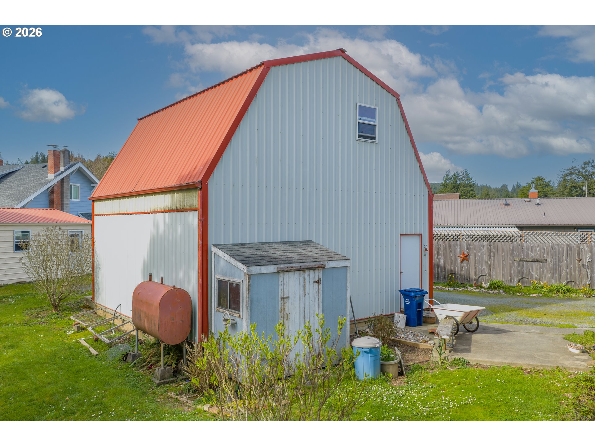 1150 West 8th Street Coquille, OR 97423 - Photo 7 of 42 a backyard of a house with table and chairs