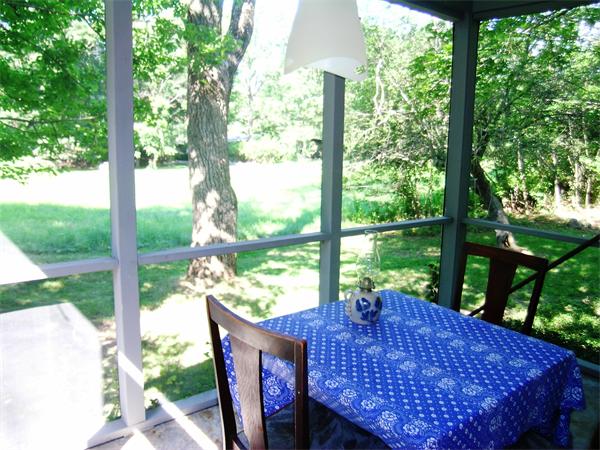 96 Conant Road Lincoln, MA 01773 - Photo 6 of 12 a view of a patio with a table chairs and a backyard