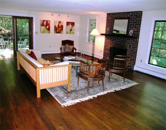 96 Conant Road Lincoln, MA 01773 - Photo 8 of 12 a living room with furniture and a fireplace
