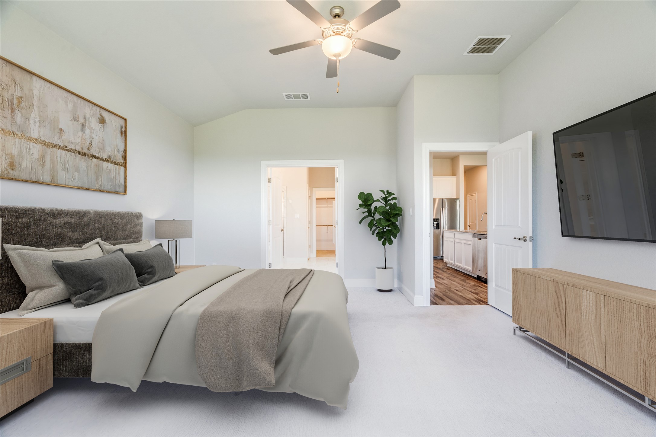 130 Sierra Blanca Road Dripping Springs, TX 78620 - Photo 14 of 24 a bedroom with a large bed and a chandelier fan