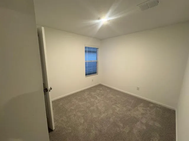 an empty room with a bathroom