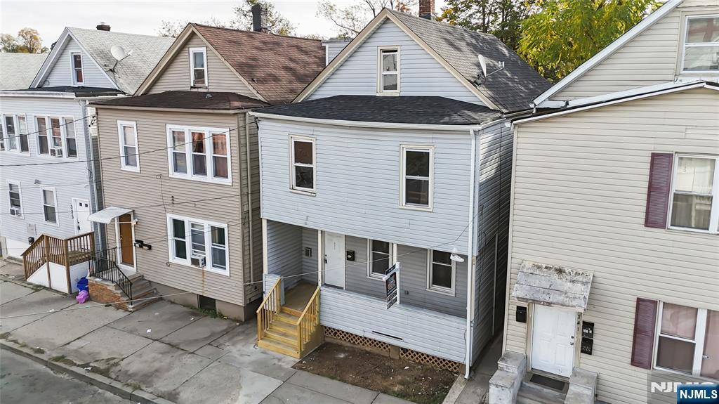 339 Howe Avenue, Unit 1 Passaic, NJ 07055 - Photo 1 of 23 a front view of a house with a tree