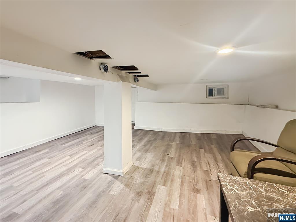 339 Howe Avenue, Unit 1 Passaic, NJ 07055 - Photo 14 of 23 a view of a room with wooden floor
