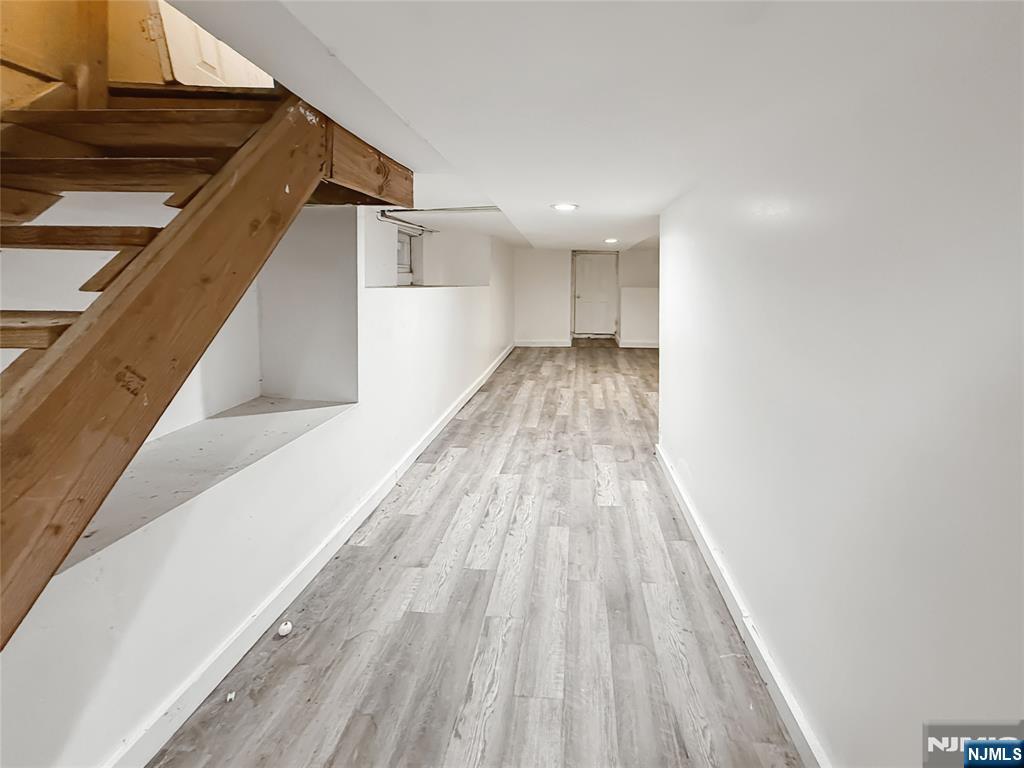 339 Howe Avenue, Unit 1 Passaic, NJ 07055 - Photo 17 of 23 a view of hallway with wooden floor