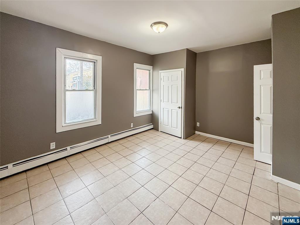 339 Howe Avenue, Unit 1 Passaic, NJ 07055 - Photo 5 of 23 a view of an empty room and window