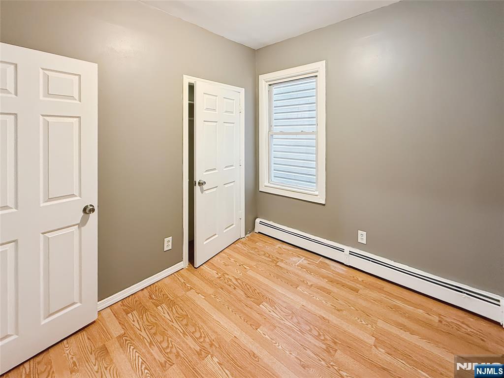 339 Howe Avenue, Unit 1 Passaic, NJ 07055 - Photo 10 of 23 an empty room with windows