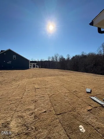 a view of residential houses with yard