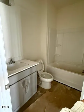 a bathroom with a sink a toilet and bathtub
