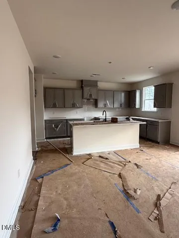 a kitchen with stainless steel appliances granite countertop a sink and cabinets