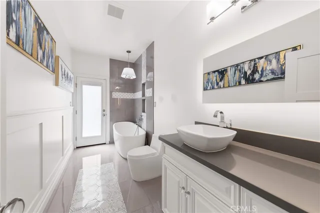 a view of a hallway with wooden floor and furniture