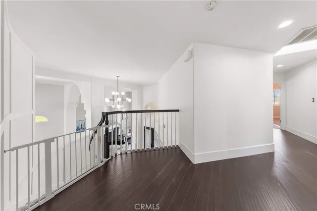 a bedroom with furniture and a book shelf