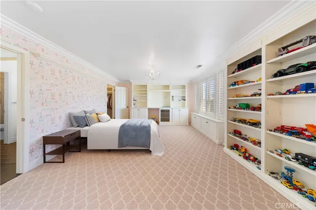 a large white bathroom with a large mirror vanity and a bathtub