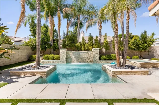 an aerial view of a house with swimming pool