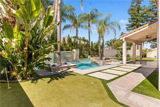 an aerial view of a residential house with yard