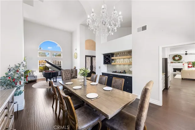 a large kitchen with stainless steel appliances granite countertop a stove a sink and a refrigerator