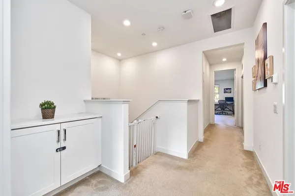 a view of hallway with livingroom and hallway