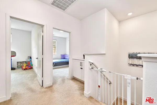 a view of a hallway view with staircase