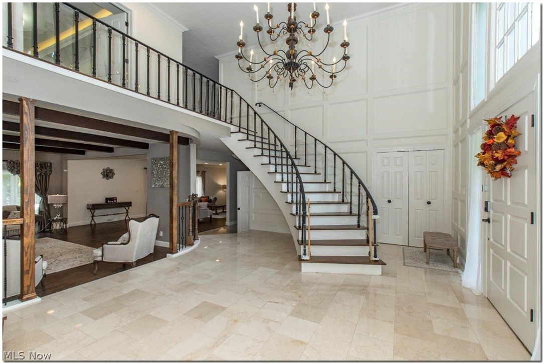 3200 Lander Road Pepper Pike, OH 44124 - Photo 4 of 35 The elegant two-story foyer has marble flooring and a dramatic curved staircase