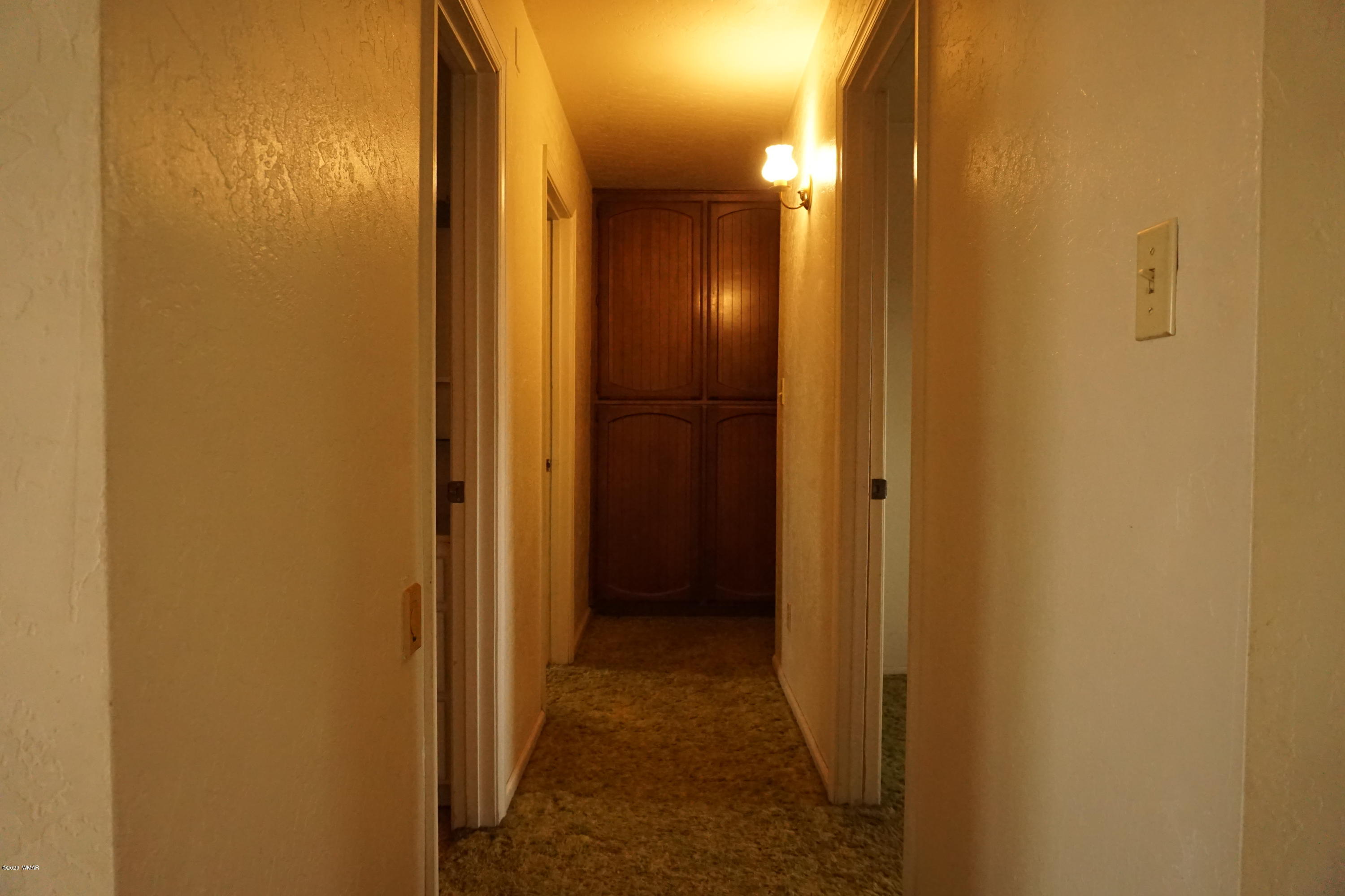 1110 7th West St. Johns, AZ 85936 - Photo 15 of 34 a view of a bathroom from a hallway