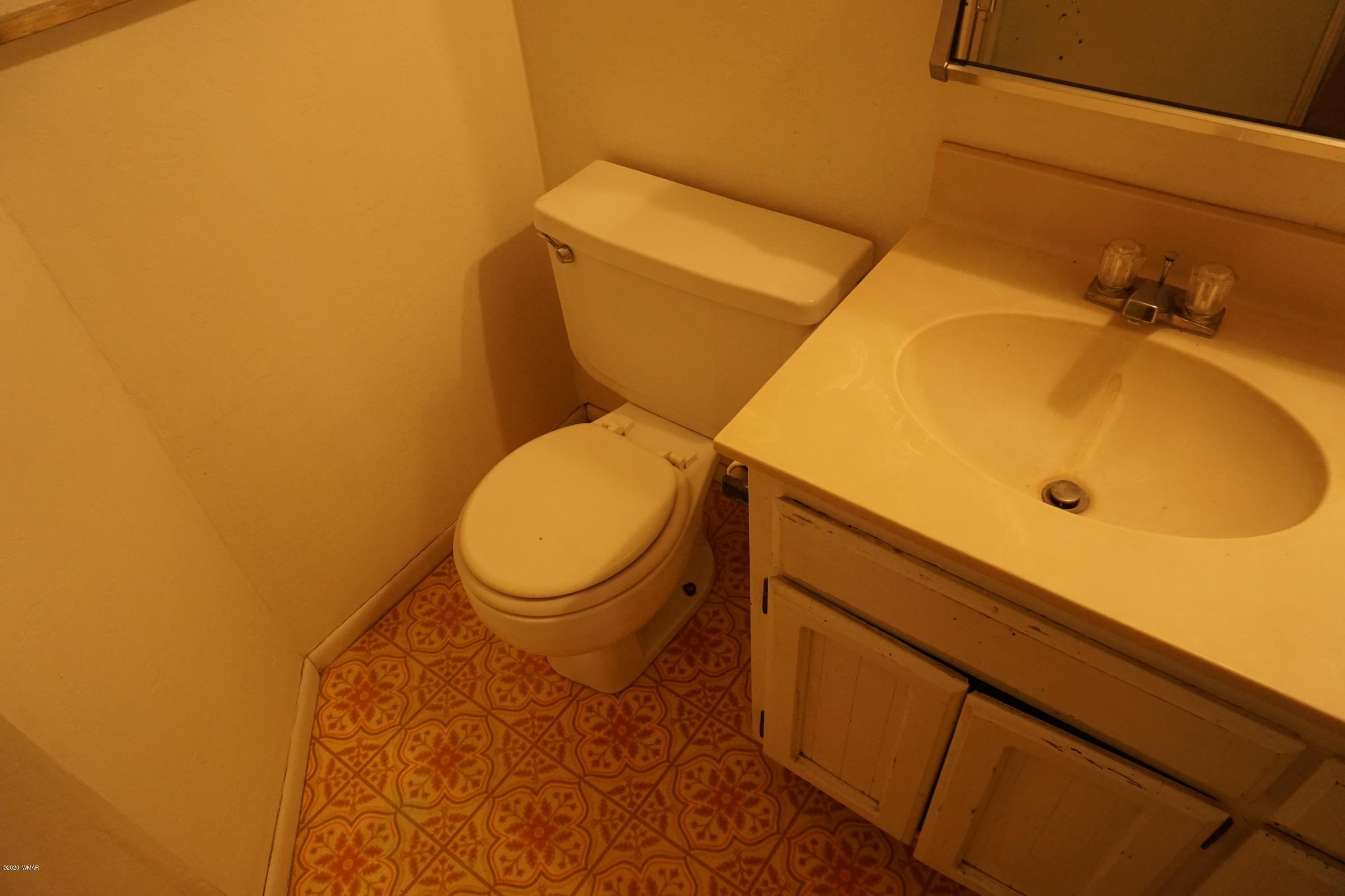 1110 7th West St. Johns, AZ 85936 - Photo 19 of 34 a bathroom with a sink and a toilet