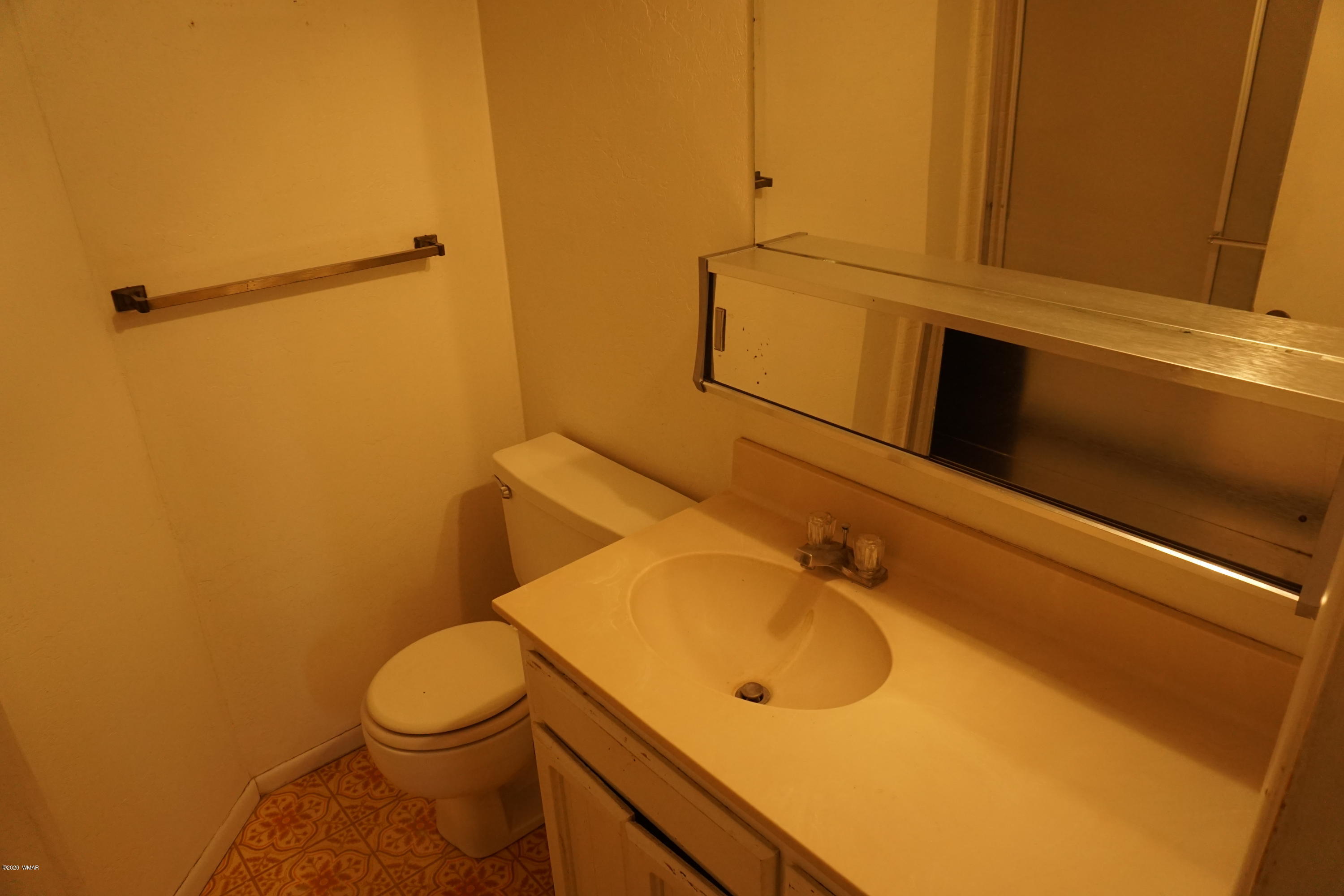 1110 7th West St. Johns, AZ 85936 - Photo 21 of 34 a bathroom with a sink and toilet
