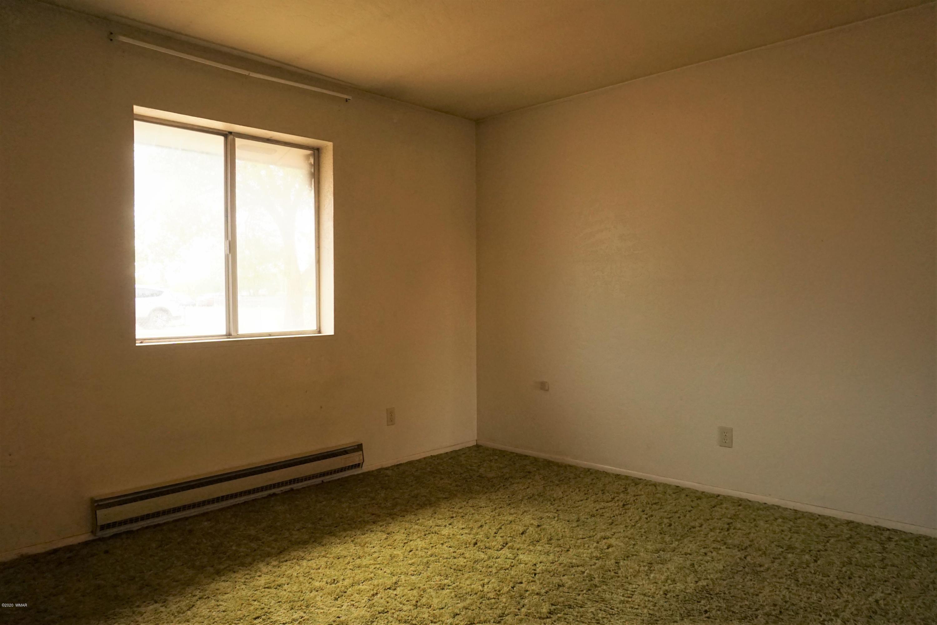 1110 7th West St. Johns, AZ 85936 - Photo 22 of 34 an empty room with a window