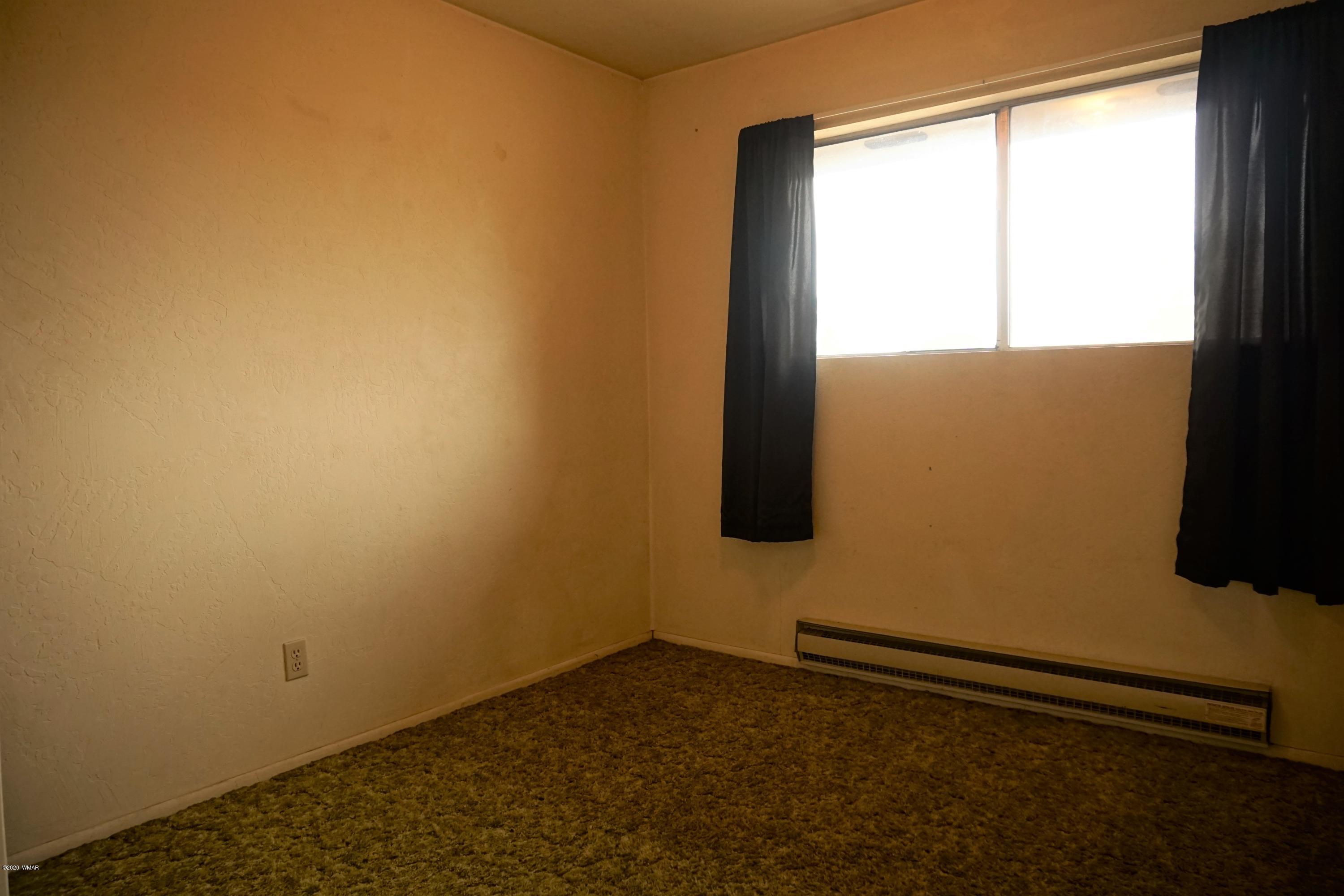 1110 7th West St. Johns, AZ 85936 - Photo 29 of 34 a view of an empty room with a window