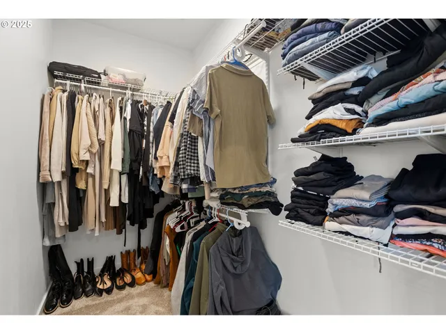 a bedroom with a bed and a table