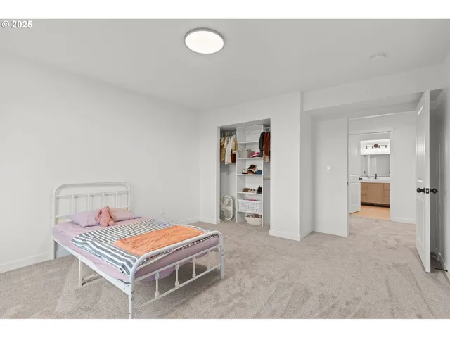 a spacious bathroom with a double vanity sink and a mirror