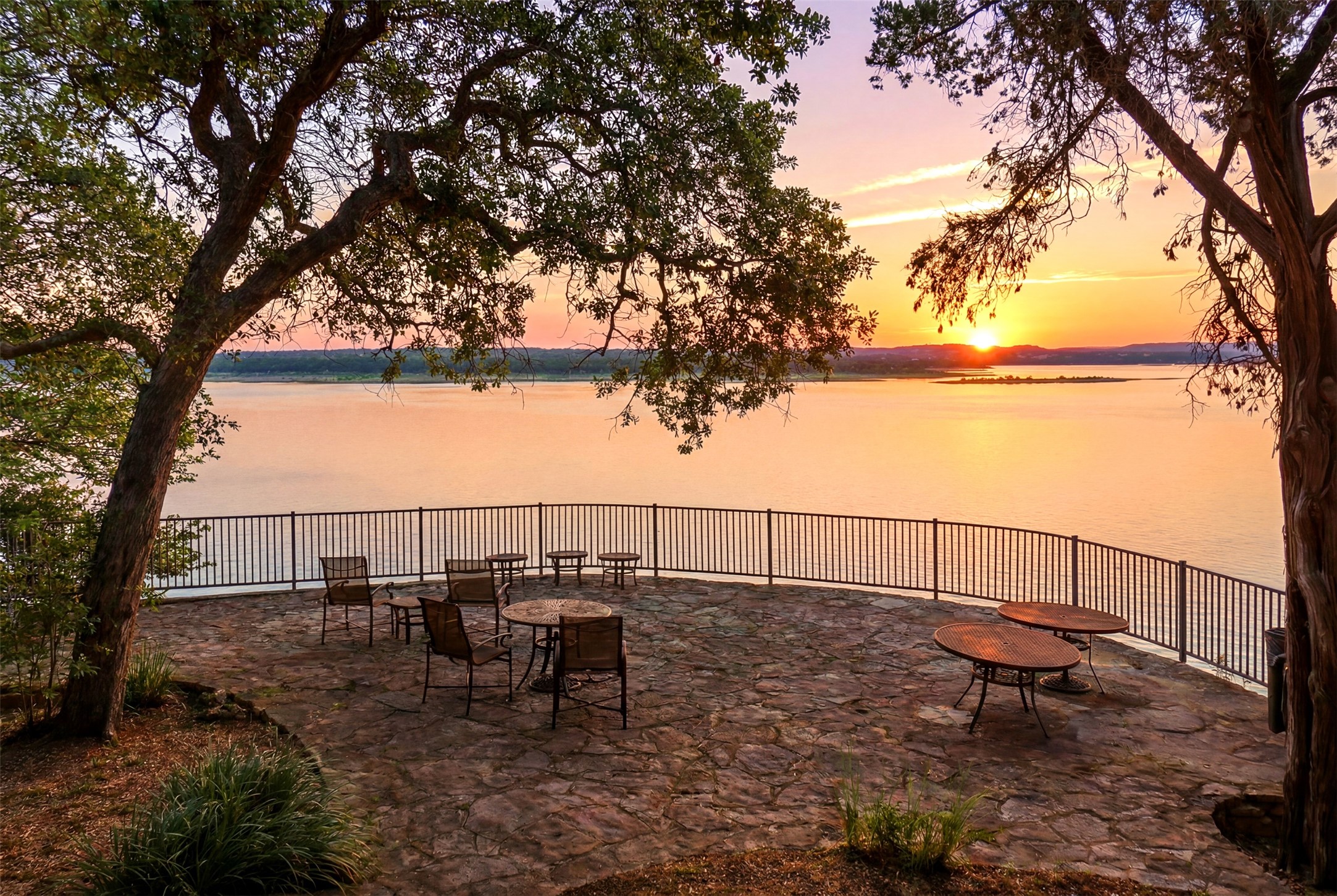 2918 Ranch Road 620, Unit 265 Austin, TX 78734 - Photo 2 of 40 Witness glorious sunsets from this waterfront patio, offering a tranquil escape.