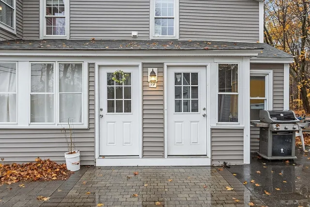 a view of a house with a window and brick walls