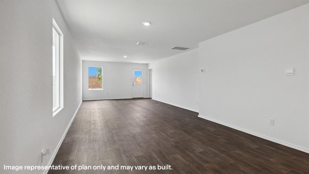 1704 Fawn Crk Drive Blue Ridge, TX 75424 - Photo 13 of 28 an empty room with wooden floor and windows